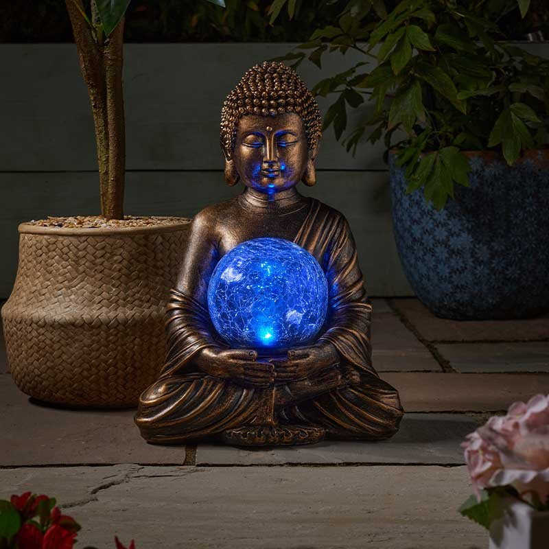 Bouddha solaire avec boule de cristal lumineuse