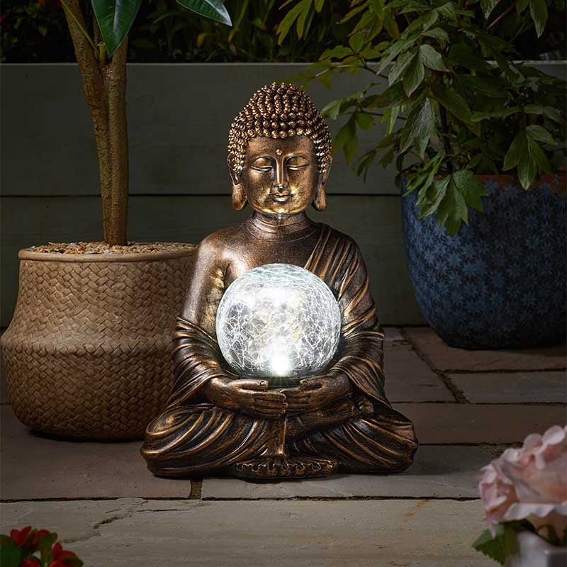 Bouddha solaire avec boule de cristal lumineuse